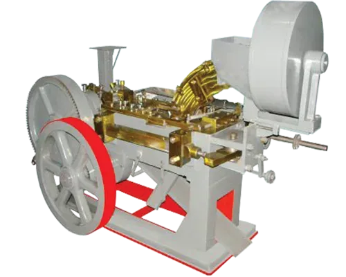 AUTOMATIC BOLT HEAD TRIMMING AND SHANK REDUCING MACHINE